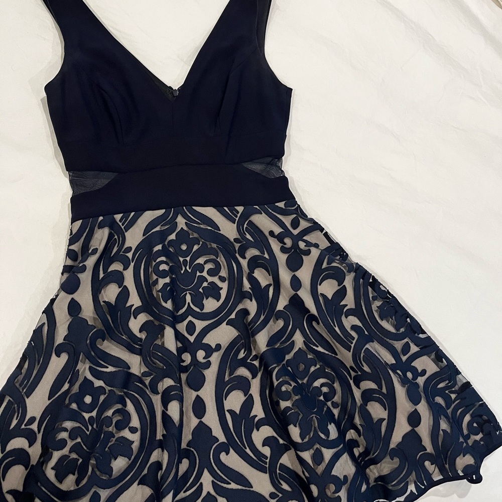 Dress. Cut out waist. Light crinoline lining.